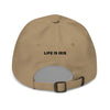 Khaki cotton cap featuring front embroidered "irie" text in black, on back featuring "life is irie" text