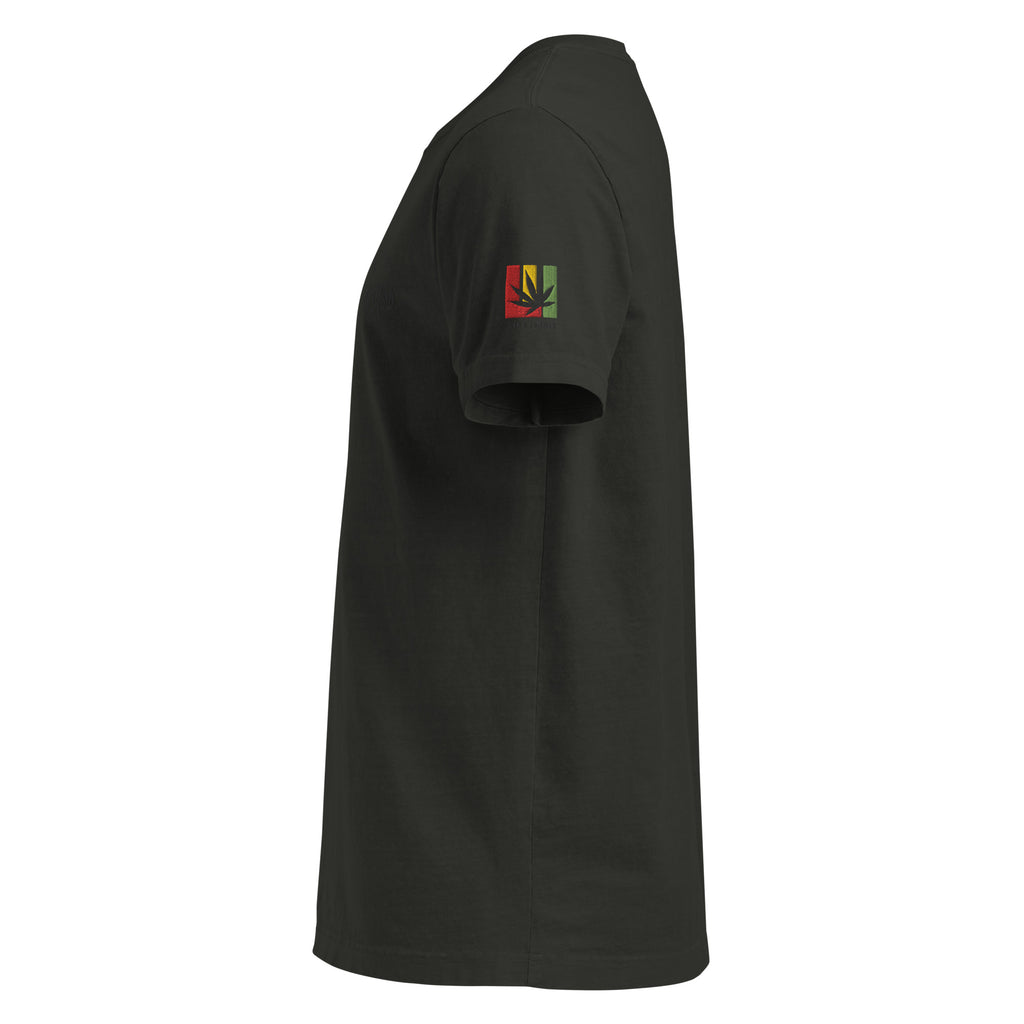 black t-shirt with a small red gold and green logo on the sleeve against a white background