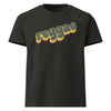 Product mock-up of a black short-sleeve T-shirt with the word 'reggae' printed across the chest in a retro 3D-style font with yellow, green, and red shadowing