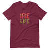 Maroon Knit t-shirt featuring front "irie life" text in Reggae colors of red, gold, green. Classic crew neck. 