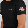 Gender neutral t-shirt in Black featuring front "LIFE IS IRIE" text graphic.  On sleeve "ONE LOVE" text graphic with Reggae colors of red, gold, green.