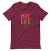 Maroon Knit t-shirt featuring front "irie life" text in Reggae colors of red, gold, green. Classic crew neck. 