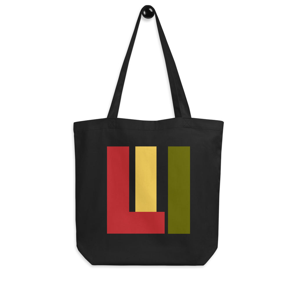 Black canvas tote with red, gold, green colors