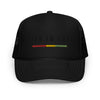 Black trucker hat featuring front 3D embroidered "life is irie" text and Reggae stripe in red, gold, green. Mesh back with adjustable closure.  