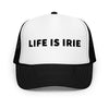 Trucker cap featuring front 3D embroidered "life is irie" text. Mesh back with adjustable closure.