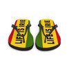 LIFE IS IRIE rubber sole flip-flop lined with a silky red, gold, and green soft fabric for comfort. 