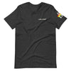 Gender neutral t-shirt in Dark Heather Grey featuring front "LIFE IS IRIE" text graphic.  On sleeve "ONE LOVE" text graphic with Reggae colors of red, gold, green.