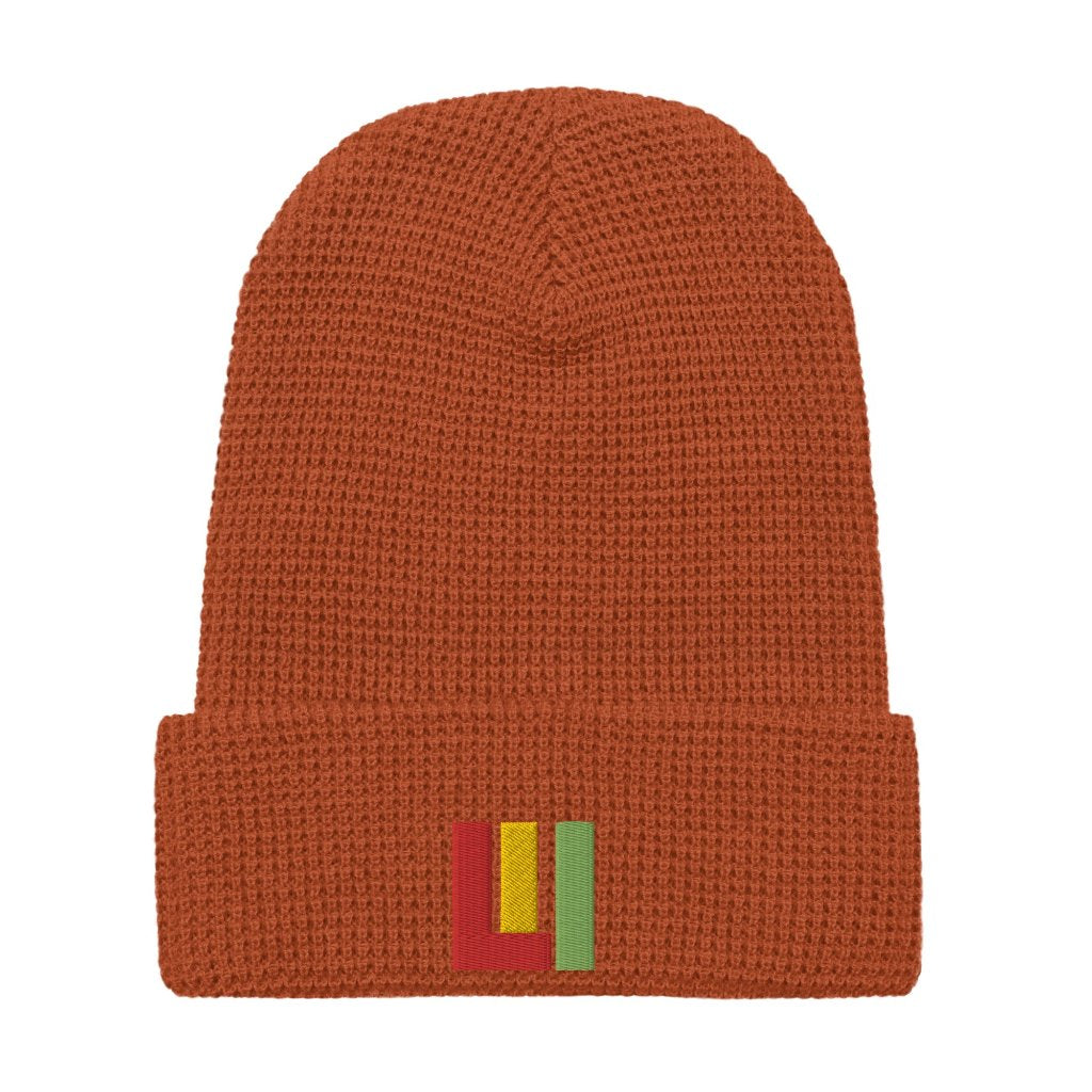 Rust honeycomb knit beanie featuring front embroidered 'life is irie' icon in red, gold, green.