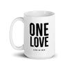 white glossy ceramic mug featuring "one love" text in black