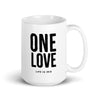 white glossy ceramic mug featuring "one love" text in black